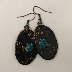 Earrings: black with blue embellishment.